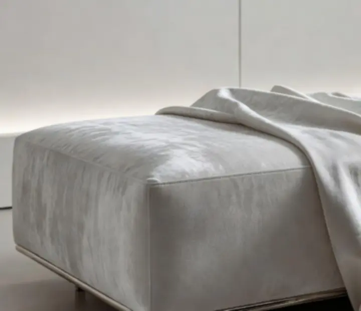 Close-up detail of platinum textiles and brushed metal finishes in the lounge