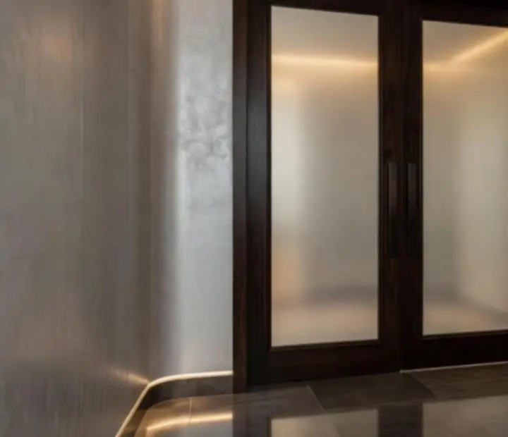 Elegantly frosted glass doors leading into the softly lit Pocket Card Salon lounge